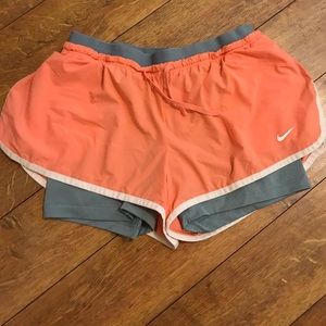 Peach Nike running shorts